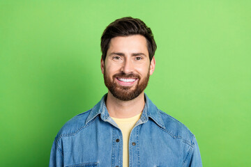 Sticker - Photo of good mood handsome guy wear denim jacket smiling empty space isolated green color background