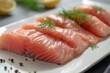 raw fish fillet on a white plate closeup, raw fish pieces closeup, raw tuna fish, raw salmon fish pieces closeup