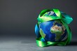 The globe wrapped in blue and green ribbons for World Asthma Day