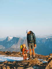 Wall Mural - Father and daughter child on mountain top in Norway climbing together, family adventure hobby healthy lifestyle outdoor active vacations dad with kid
