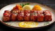   A white plate bears a portion of meat smothered in sauce, accompanied by a lemon wedge for garnish