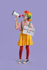 Wall Mural - Funny little girl dressed as clown with card shouting into megaphone on lilac background. April Fools' Day celebration