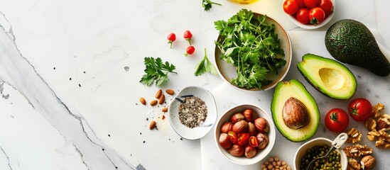 Flat lay composition featuring fresh vegetarian meal ingredients on a white marble cutting board. Emphasizing raw food elements such as organic fruits, nuts, and vegetables, with avocado,