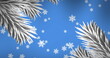 Snowflakes are falling gently against blue background