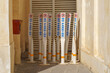 Close-up view of several plastic signs, pillars with a no parking sign standing in a corner of the street in the Souq Waqif bazaar area, at daytime, Doha, Qatar