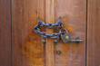 Doha, Qatar Close up view of a vintage lock with chain on a wooden door