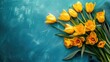 Bright yellow tulips on textured blue background