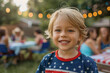 Adorable Caucasian little boy portrait wearing American t-shirt for 4th of July celebrating in outdoors