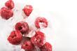 Raspberries with ice on isolated fruit on white background for organic nutrition copy space.