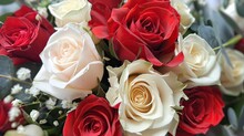 A Lovely Bunch Of Flowers Featuring A Delicate Mix Of Vibrant Red And Pristine White Roses