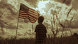 boy in a field next to the flag of the United States