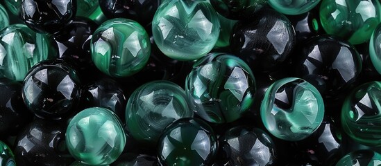 Wall Mural - Photo of a background with marbles in black and green