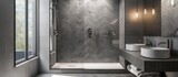 Fototapeta  - Contemporary bathroom in grey with herringbone-patterned shower tiles