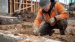 © Phoophinyo - The engineer carefully inspects the foundation of the new building, ensuring it meets safety standards.