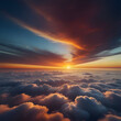 Aerial view above clouds at sunset. Colorful dramatic sky.
