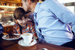 © Davor - Father and son bonding over dessert in cafe