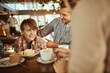 © Davor - Family enjoying time together at a cafe
