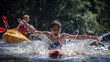 Children enjoying water activities at a summer camp lake