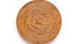 Rattan place mat or round woven placement isolated on white background.