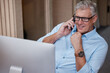 © peopleimages.com - Mature man, phone call or computer in home office planning for retirement, investment and communication. Smile, online or happy senior advisor with remote work for consulting and mobile connection