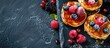 English-style crumpets topped with berries and honey, presented on a black marble surface, in a flatlay composition with space for text.