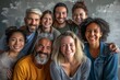 © antusher - a diverse group of smiling people, featuring a mix of ethnicities and ages, closely standing together in a friendly group portrait