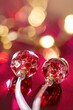 Two red and gold ear buds with a shiny surface on them. Generative AI.