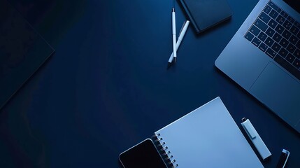 Home office desk Laptop mobile note book and pen on dark blue background Stylish workspace Top view flat lay copy space : Generative AI