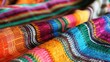 Adorning your space with a vibrant Mexican blanket known as a sarape can instantly inject a burst of colorful charm