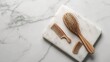 Flat lay composition with wooden hair brush and comb on white marble table : Generative AI