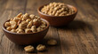 Nuts in a plate on a wooden background. View from above. Place for text, empty space.