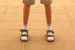 Legs in socks and sandals