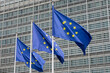 © respiro888 - Fluttering European Union flags in a row in Brussels, Belgium. Close up