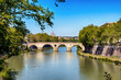 Vuew of Tiber river and bridge in Rome at sunny day.