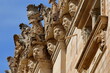 Details (human faces) of Impellizzeri Palace, a Rococo and baroque style building dated from 1894 and located along Via Maestranza street in Ortigia Island, Syracuse, Sicily, Italy