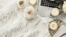 Freelance Fashion Comfortable Feminine Workspace In Flat Lay Style With Laptop Vintage Tray Roses Candles Notebook And Pen On White Fur Background Top View Flat Lay Freelance Concept : Generative AI