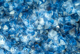 Fototapeta  - Blue Crystal Mineral Stone. Gems. Mineral crystals in the natural environment. Texture of precious and semiprecious stones. Seamless background with copy space colored shiny surface of precious stones