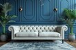 A stylish living room interior with a classic white Chesterfield sofa, vibrant blue walls and chic decor