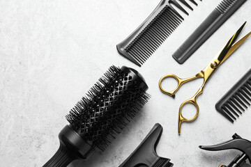 Wall Mural - Hairdressing tools on light background, flat lay. Space for text