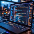 © Vesovic  - A laptop open on the table with a screen showing vibrant lines of code, illustrating software development or programming tasks