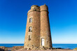L'ancien phare du Cap Fréhel, emblème chargé d'histoire des Côtes d'Armor, trône majestueusement sur la côte bretonne, rappelant la grandeur passée de la navigation maritime dans la région.