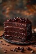 A decadent multi-layer chocolate cake with cherries on a rustic table.