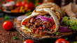 Turkish Doner Kebab with vegetables and sliced meat on wooden board.