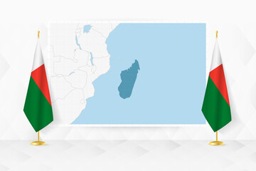 Wall Mural - Map of Madagascar and flags of Madagascar on flag stand.
