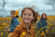 Group of smiling children walking on the field near wind turbines. AI Generated