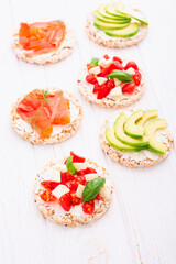 Wall Mural - Crispbread with  salmon avocado mozzarella  and tomatoes