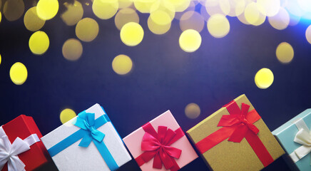 Wall Mural - Christmas decoration. Gift boxes on black stone  background. Christmas greeting card concept.