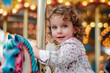 Curly Haired Toddler Enjoys Merry-Go-Round at Fair
