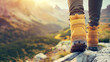Rear view of a person's legs in yellow hiking boots walking in beautiful Swiss mountains in autumn