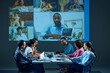 © master1305 - Workers sitting in office boardroom participate in virtual meeting, with remote colleagues via online video call. Concept of business, entrepreneurship, communication, teamwork. Education startup